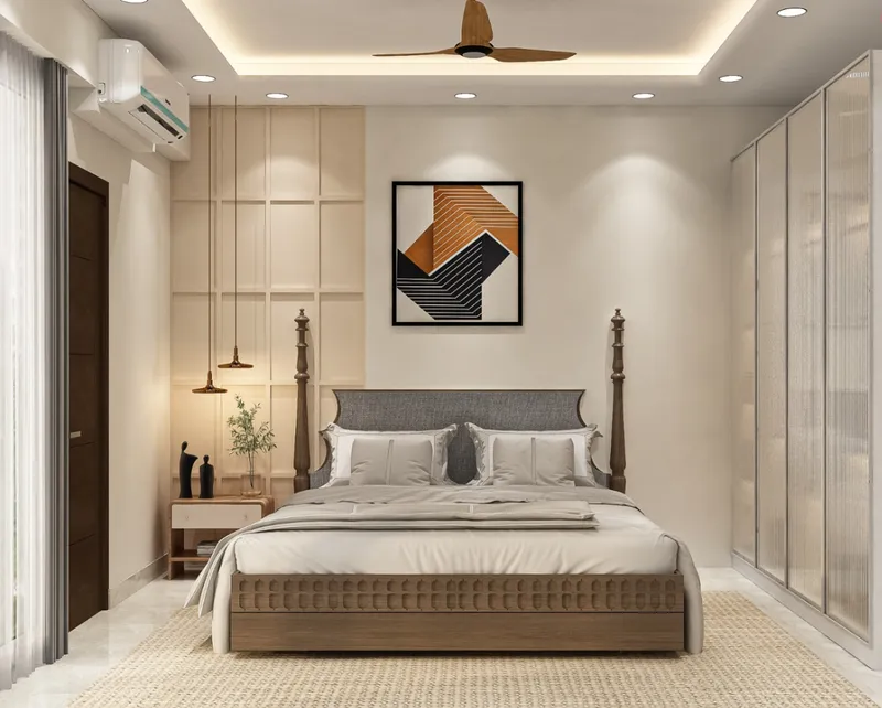 Bedroom with a four-poster bed and full-height wardrobes